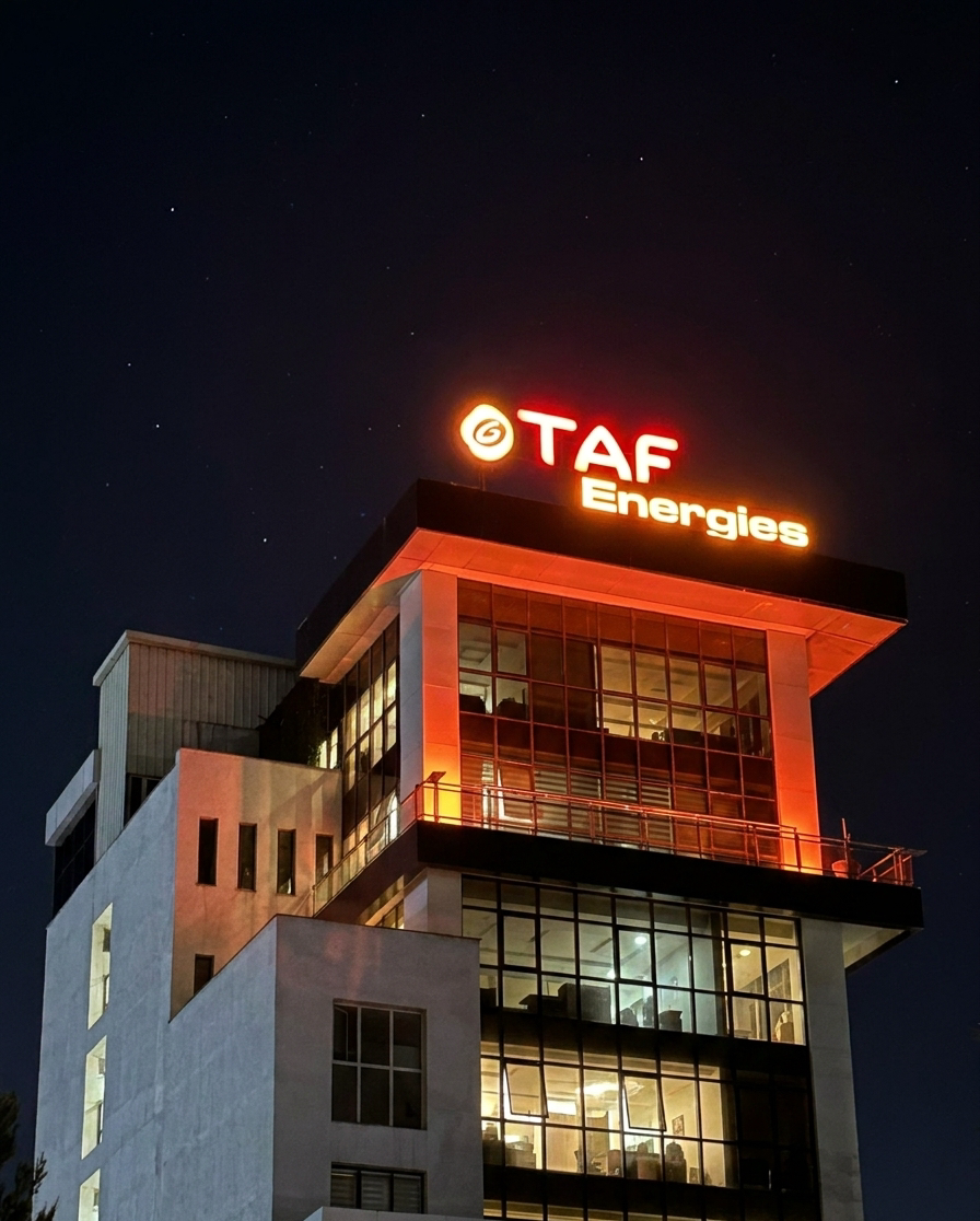 TAF Energies headquarters building at night